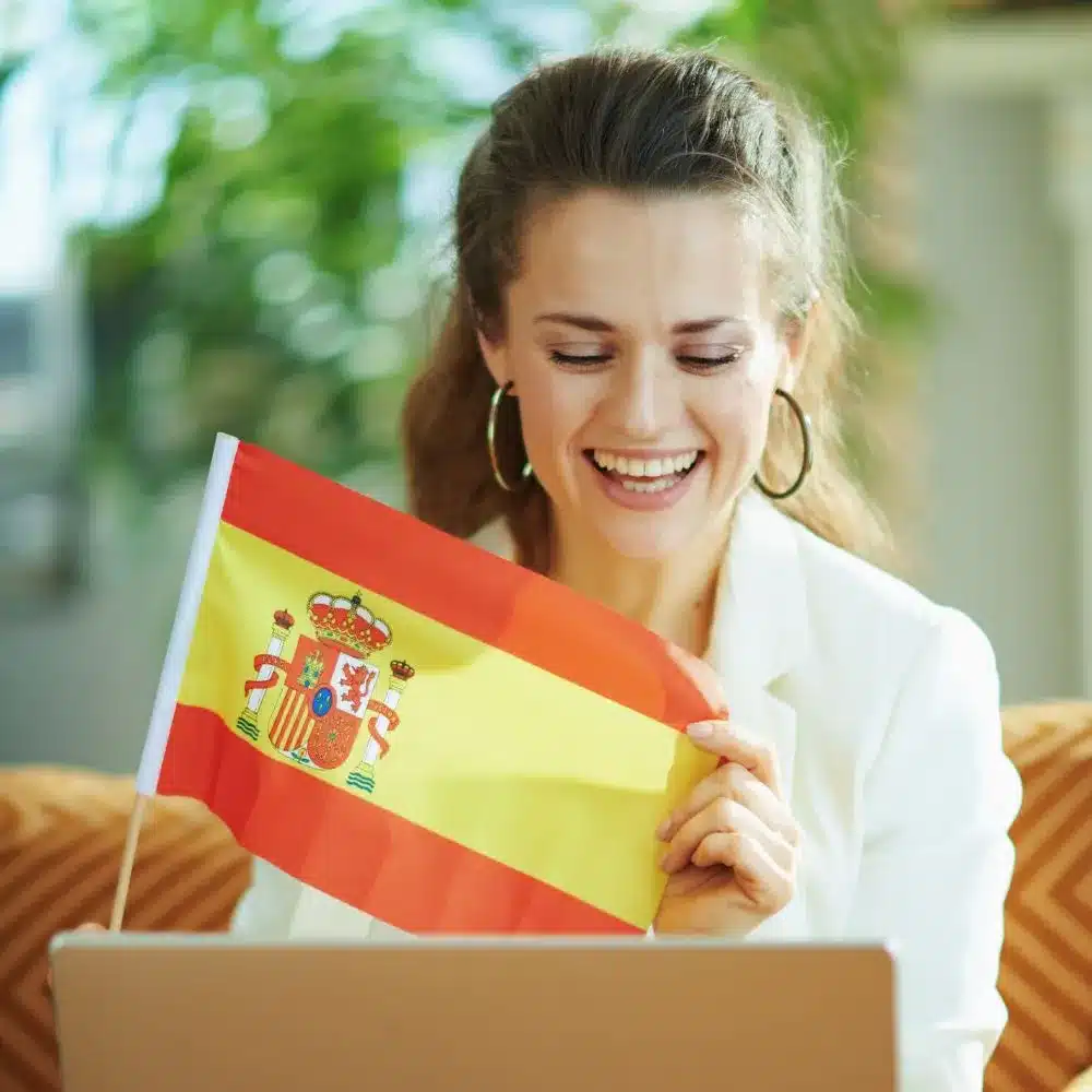 6716860ba9a52efc3f66f744 Woman with spanish flag